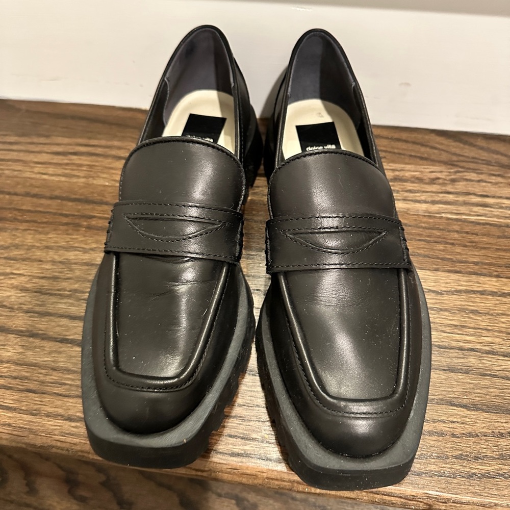 Square toed black leather loafers